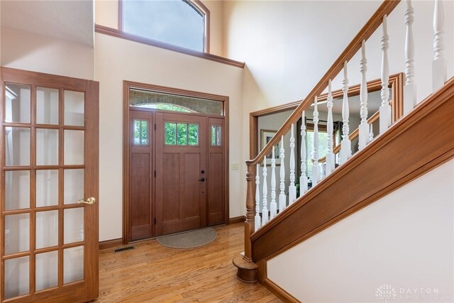 3875 Ferry Rd, Sugarcreek Twp, OH 45305 - foyer entrance featuring light wood-style floors and stairway