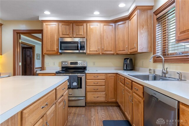 3875 Ferry Rd, Sugarcreek Twp, OH 45305 - kitchen with appliances with stainless steel finishes, light countertops, light wood-style floors, and recessed lighting