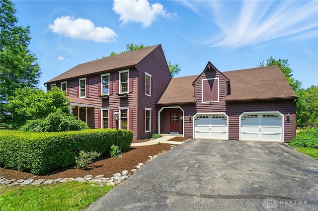 7255 State Route 48, Springboro, OH 45066 - colonial-style house with driveway, an attached garage, and a shingled roof