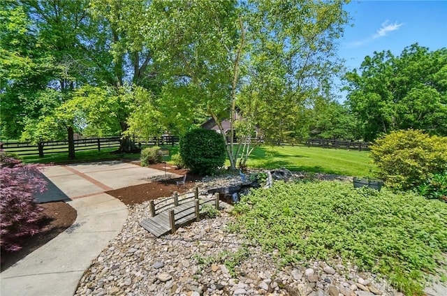 7255 State Route 48, Springboro, OH 45066 - fenced yard featuring a patio and view of scattered trees