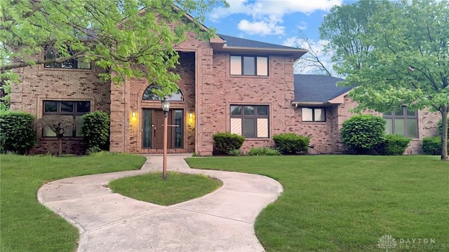 7171 Dominican Dr, Clayton, OH 45415 - view of front of house featuring brick siding and a front yard