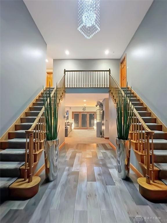 7171 Dominican Dr, Clayton, OH 45415 - stairs with recessed lighting, a chandelier, and wood finished floors