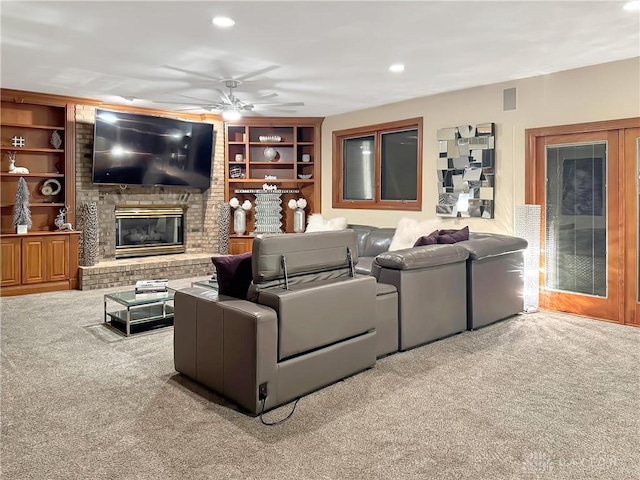 7171 Dominican Dr, Clayton, OH 45415 - carpeted living area featuring a ceiling fan, built in shelves, a fireplace, and recessed lighting