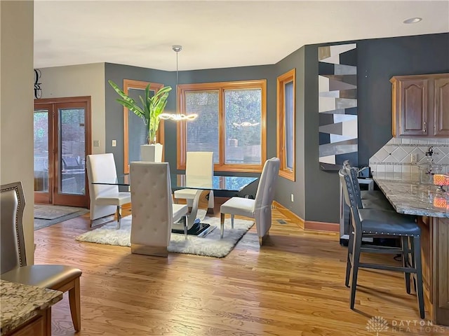 7171 Dominican Dr, Clayton, OH 45415 - dining area with light wood-style flooring and baseboards