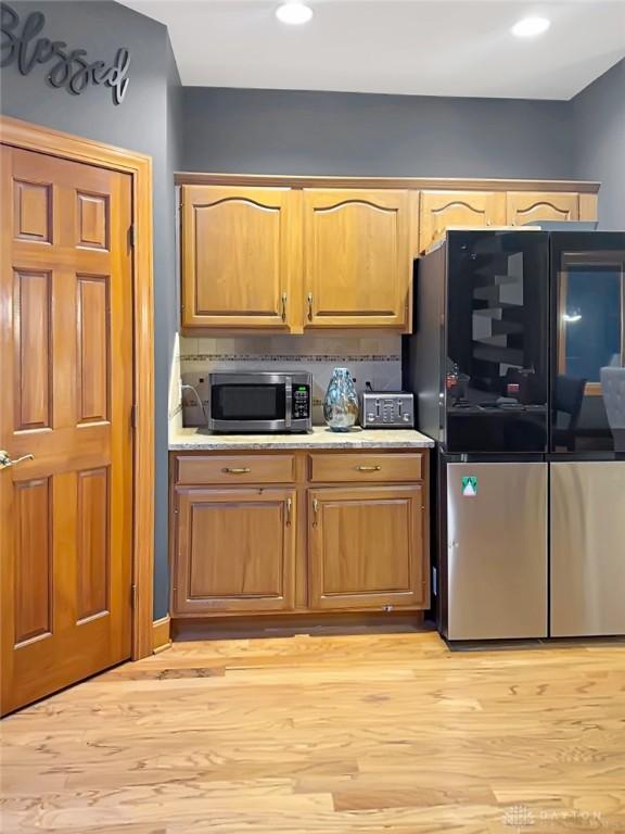 7171 Dominican Dr, Clayton, OH 45415 - kitchen with appliances with stainless steel finishes, light wood-type flooring, light countertops, and recessed lighting