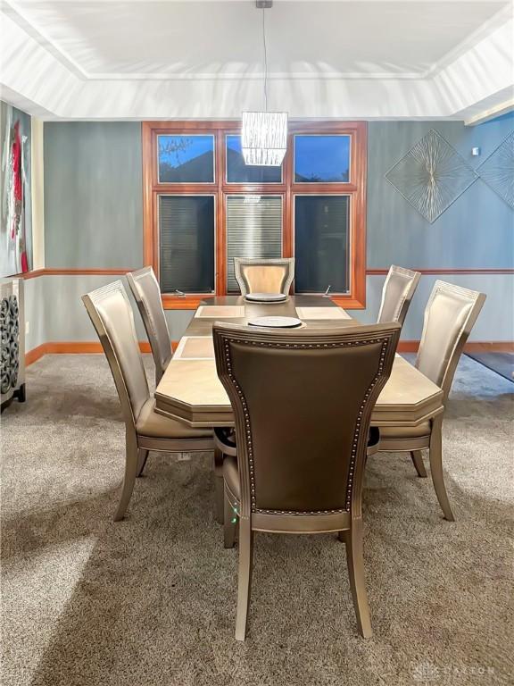 7171 Dominican Dr, Clayton, OH 45415 - dining room with carpet and a chandelier