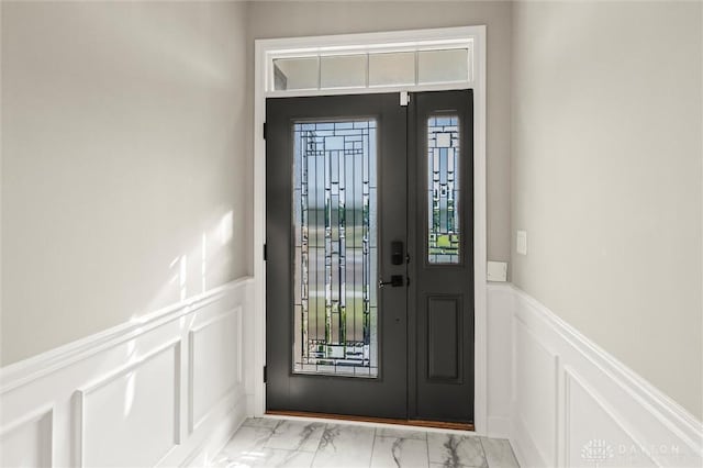 1796 Archerfield Pl, Miamisburg, OH 45342 - entryway with a decorative wall, marble look tiles, and a wainscoted wall