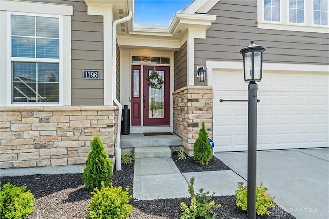 1796 Archerfield Pl, Miamisburg, OH 45342 - doorway to property with stone siding and an attached garage