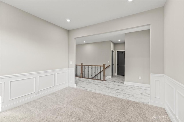 1796 Archerfield Pl, Miamisburg, OH 45342 - spare room featuring a decorative wall, recessed lighting, a wainscoted wall, and light marble finish floors