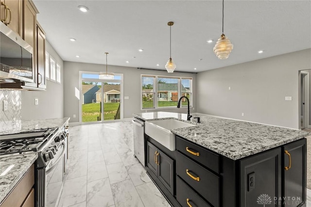 1796 Archerfield Pl, Miamisburg, OH 45342 - kitchen with stainless steel appliances, light marble finish floors, recessed lighting, an island with sink, and dark cabinets
