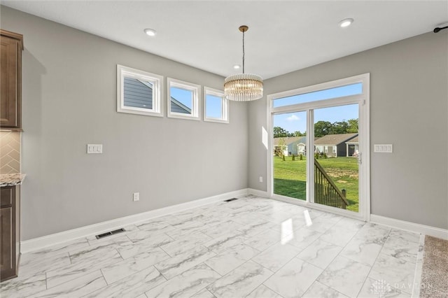 1796 Archerfield Pl, Miamisburg, OH 45342 - unfurnished dining area featuring light marble finish flooring, a chandelier, and recessed lighting
