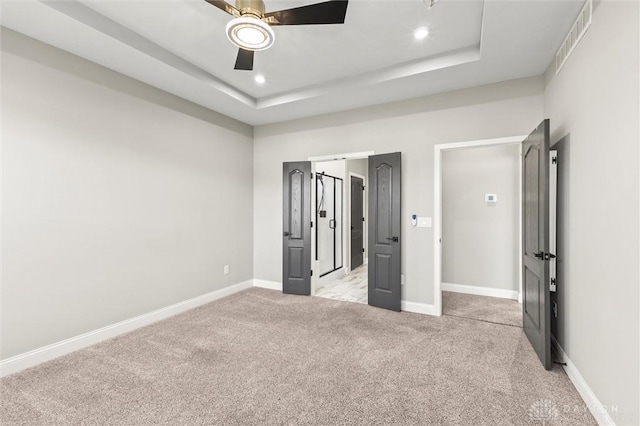 1796 Archerfield Pl, Miamisburg, OH 45342 - unfurnished bedroom featuring light carpet, a raised ceiling, ceiling fan, and recessed lighting