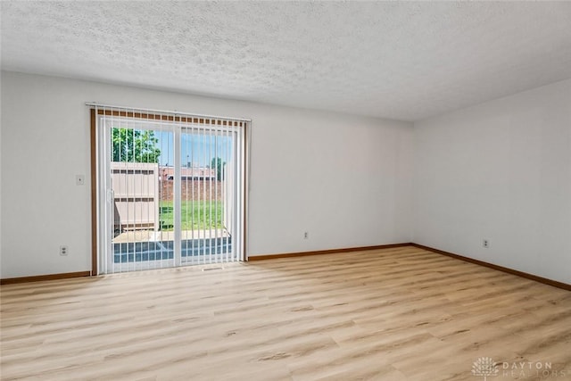 7607 Paragon Commons Cir, Dayton, OH 45459 - empty room featuring light wood-style floors and a textured ceiling
