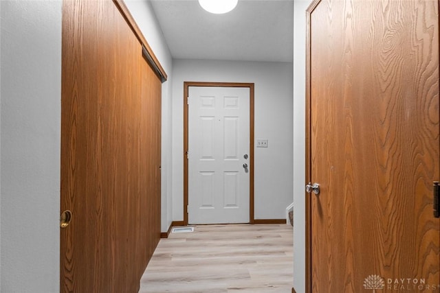 7607 Paragon Commons Cir, Dayton, OH 45459 - doorway to outside featuring light wood finished floors and baseboards