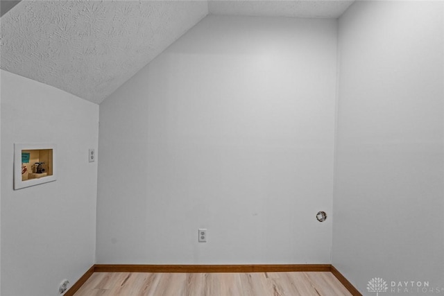 7607 Paragon Commons Cir, Dayton, OH 45459 - laundry room featuring washer hookup, light wood-style flooring, and a textured ceiling