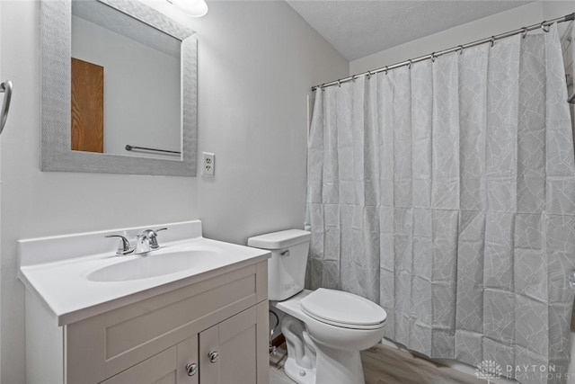 7607 Paragon Commons Cir, Dayton, OH 45459 - full bath featuring vanity, wood finished floors, and a textured ceiling