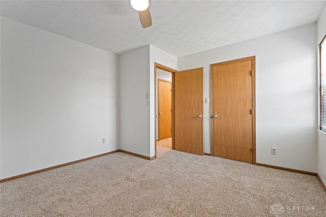 7607 Paragon Commons Cir, Dayton, OH 45459 - unfurnished bedroom featuring carpet, a ceiling fan, and a textured ceiling