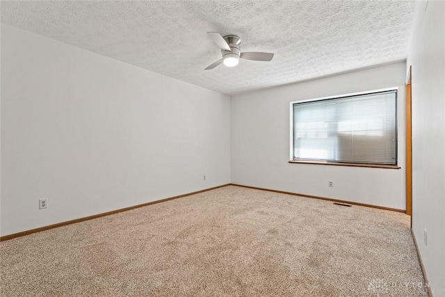 7607 Paragon Commons Cir, Dayton, OH 45459 - unfurnished room with carpet floors, a ceiling fan, and a textured ceiling