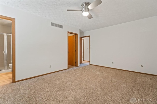 7607 Paragon Commons Cir, Dayton, OH 45459 - empty room featuring light carpet, ceiling fan, and a textured ceiling