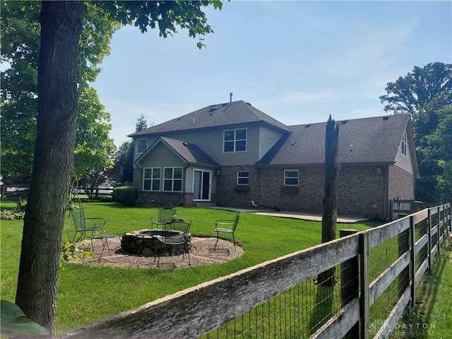 1052 Windpointe Way, Englewood, OH 45322 - rear view of property featuring an outdoor fire pit, brick siding, and a patio area