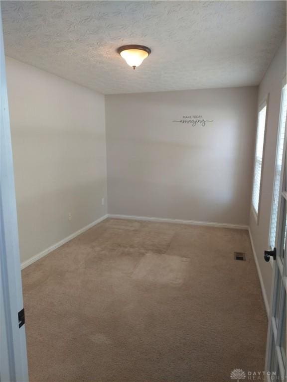 1052 Windpointe Way, Englewood, OH 45322 - spare room featuring carpet and a textured ceiling