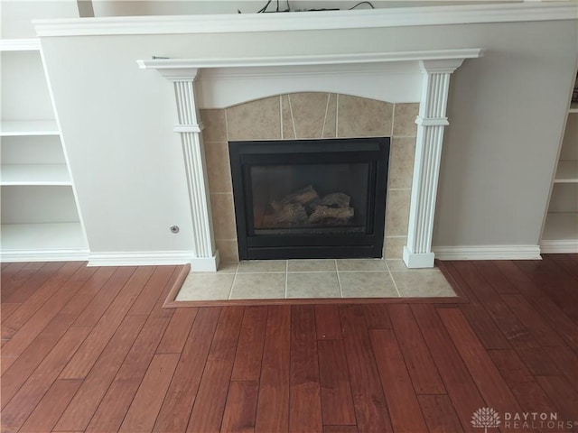1052 Windpointe Way, Englewood, OH 45322 - detailed view of wood finished floors, a fireplace, and built in features