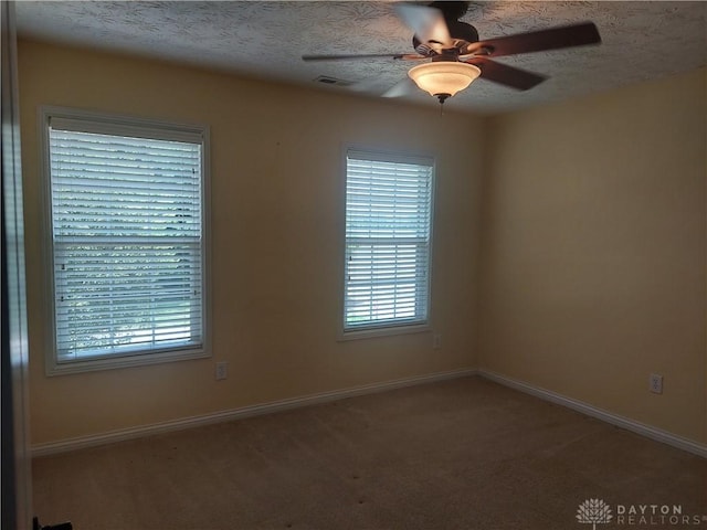1052 Windpointe Way, Englewood, OH 45322 - carpeted spare room featuring ceiling fan and a textured ceiling