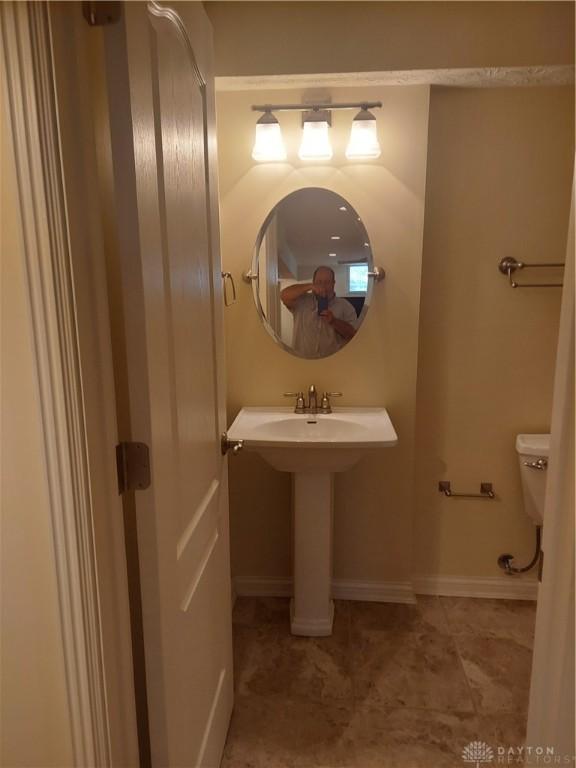 1052 Windpointe Way, Englewood, OH 45322 - half bathroom featuring toilet and a sink