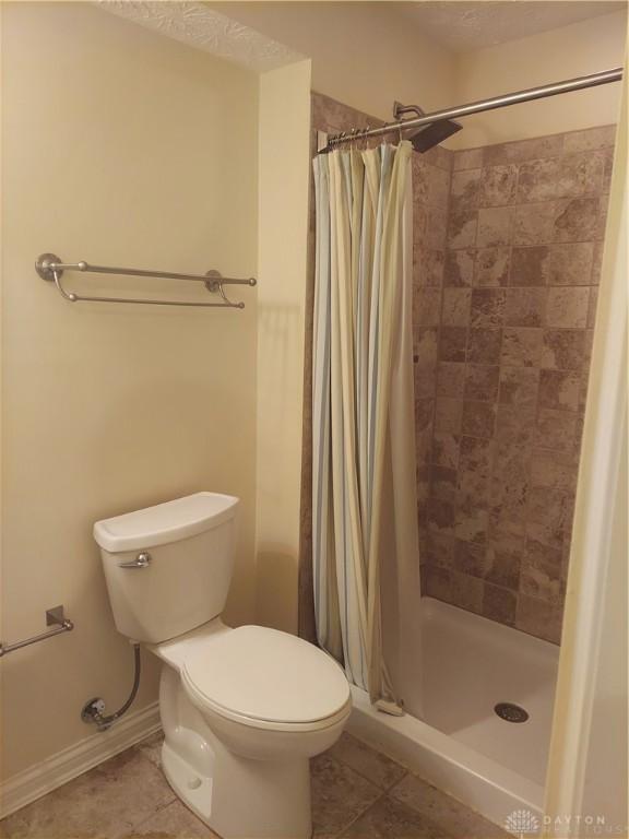 1052 Windpointe Way, Englewood, OH 45322 - full bath featuring tile patterned flooring and a shower stall