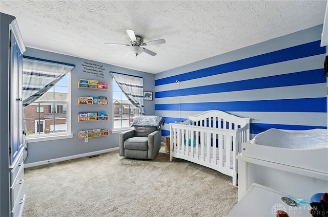 1662 S Branch Rd, Centerville, OH 45458 - carpeted bedroom featuring a crib, a ceiling fan, and a textured ceiling