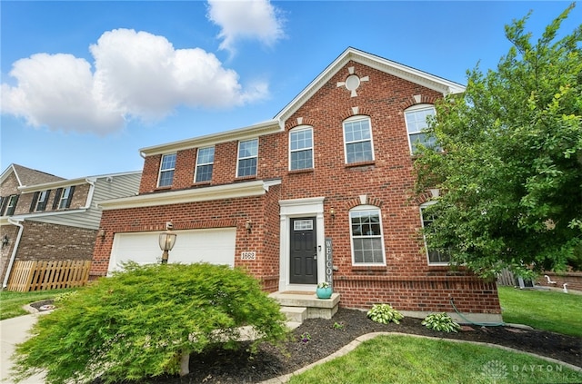 1662 S Branch Rd, Centerville, OH 45458 - view of front facade with brick siding and a garage