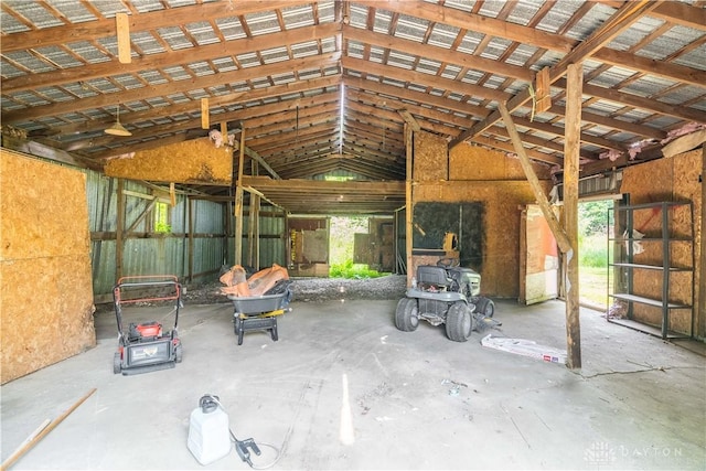 675 W Geiserman Rd, Piqua, OH 45356 - miscellaneous room with unfinished concrete flooring, healthy amount of natural light, and lofted ceiling