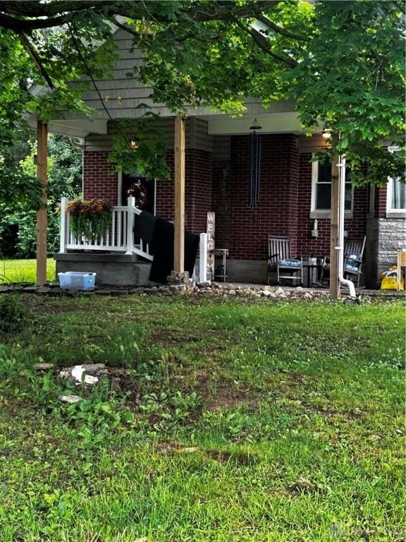 3348 Phillipsburg Union Rd, Englewood, OH 45322 - view of grassy yard with covered porch