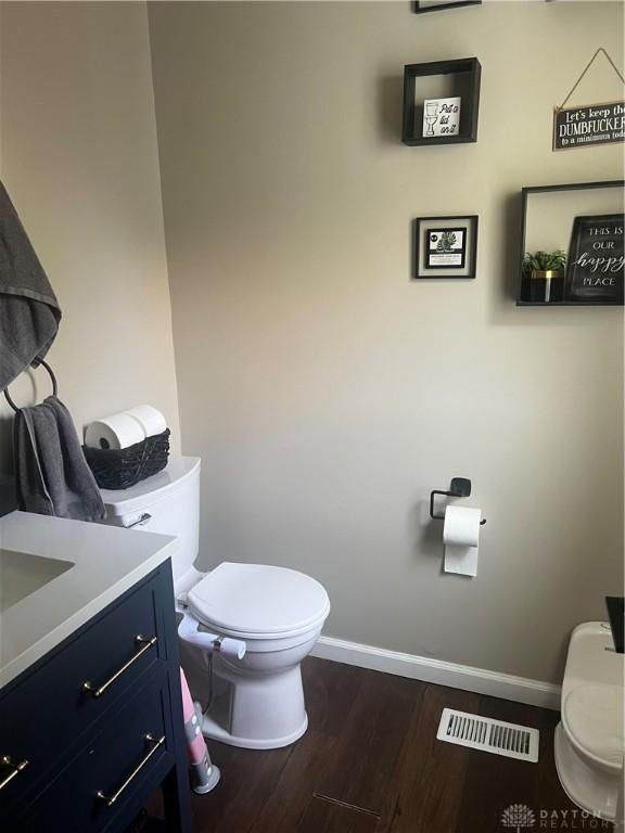 3348 Phillipsburg Union Rd, Englewood, OH 45322 - half bath featuring wood finished floors and vanity