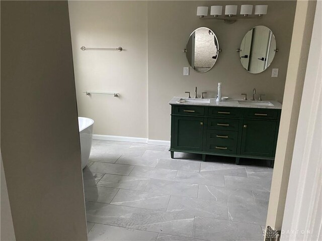 3348 Phillipsburg Union Rd, Englewood, OH 45322 - bathroom with double vanity, a freestanding bath, and marble finish floors