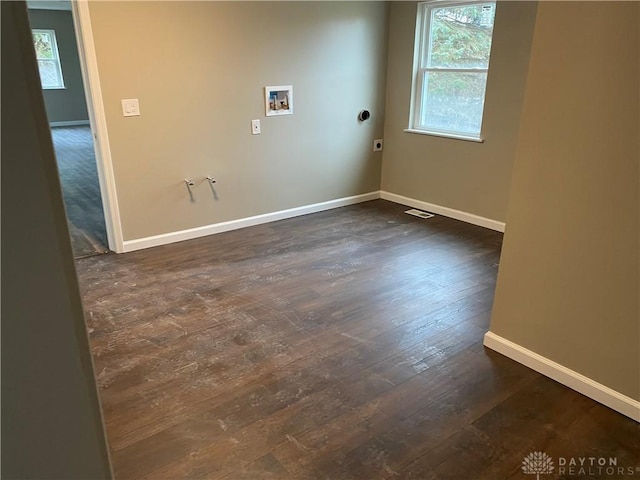 3348 Phillipsburg Union Rd, Englewood, OH 45322 - spare room featuring baseboards and dark wood-style flooring
