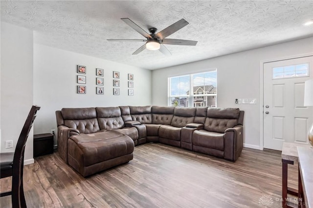 1918 Bessie Ave, Moraine, OH 45439 - living area with wood finished floors, ceiling fan, and a textured ceiling