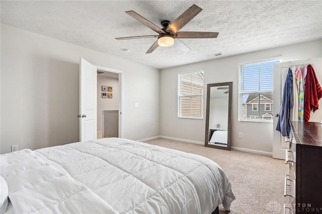 1918 Bessie Ave, Moraine, OH 45439 - bedroom with light carpet, a textured ceiling, and a ceiling fan