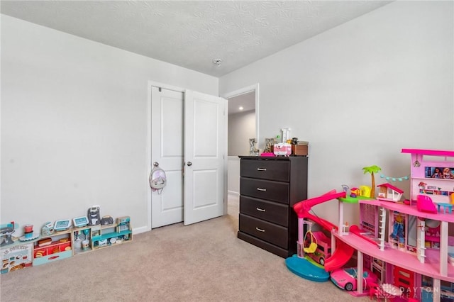 1918 Bessie Ave, Moraine, OH 45439 - rec room featuring carpet flooring and a textured ceiling