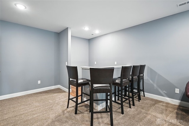 1584 Heritage Run Dr, Lebanon, OH 45036 - dining space with carpet floors and recessed lighting