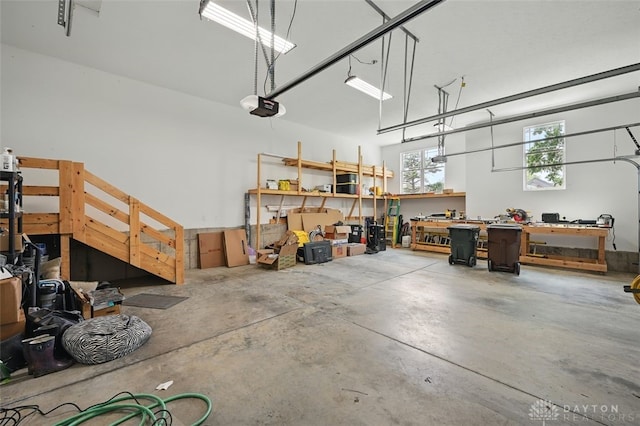 1584 Heritage Run Dr, Lebanon, OH 45036 - garage featuring a garage door opener and a workshop area