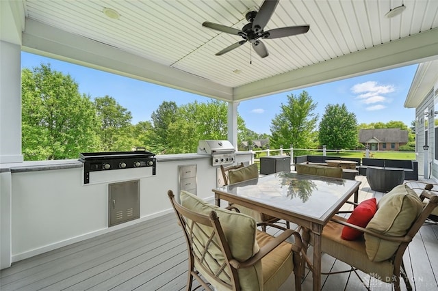 1584 Heritage Run Dr, Lebanon, OH 45036 - wooden terrace with an outdoor kitchen, a ceiling fan, and outdoor dining area