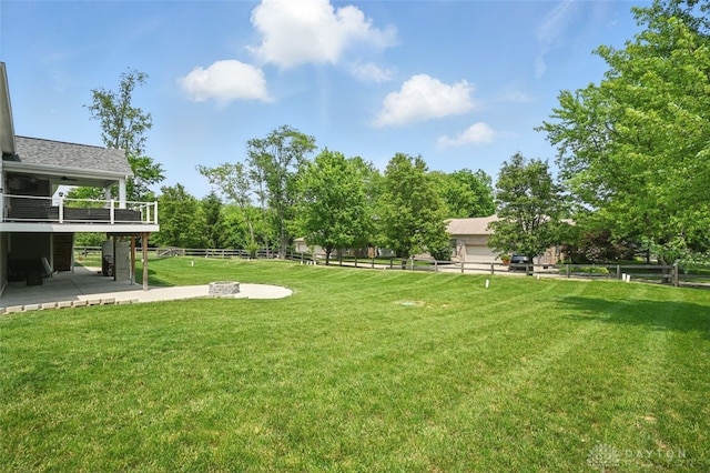 1584 Heritage Run Dr, Lebanon, OH 45036 - fenced backyard featuring an outdoor fire pit and a patio area