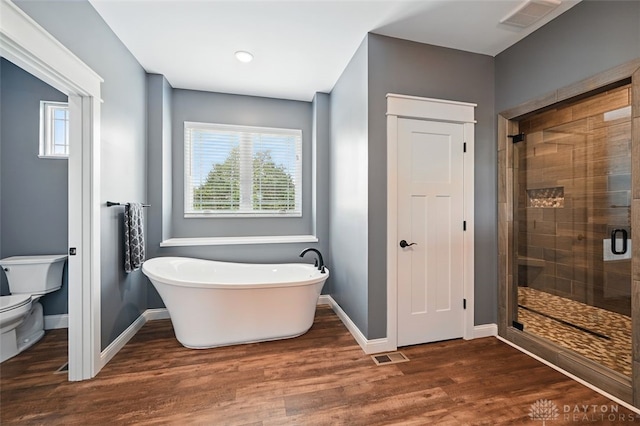 1584 Heritage Run Dr, Lebanon, OH 45036 - bathroom featuring a freestanding tub, a shower stall, plenty of natural light, and wood finished floors