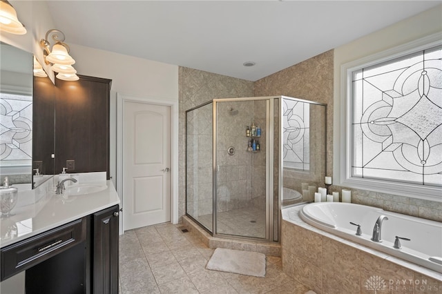 4738 Saddletop Ridge Ln, Mason, OH 45040 - bathroom with vanity, a bath, a stall shower, and tile patterned floors