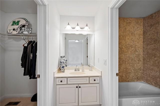 4738 Saddletop Ridge Ln, Mason, OH 45040 - bathroom with vanity, a spacious closet, and bathing tub / shower combination