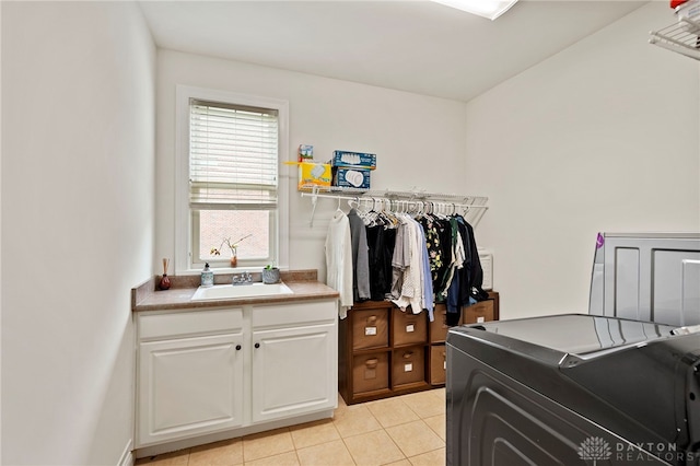 4738 Saddletop Ridge Ln, Mason, OH 45040 - laundry area with cabinet space, light tile patterned floors, and separate washer and dryer