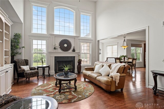 4738 Saddletop Ridge Ln, Mason, OH 45040 - living room with a towering ceiling, dark wood-style floors, and a tiled fireplace
