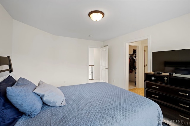 4738 Saddletop Ridge Ln, Mason, OH 45040 - bedroom featuring a walk in closet and light colored carpet