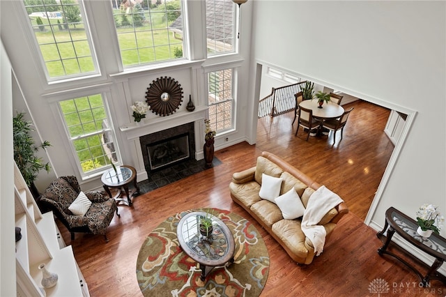 4738 Saddletop Ridge Ln, Mason, OH 45040 - living room featuring a towering ceiling, wood finished floors, and a fireplace with flush hearth